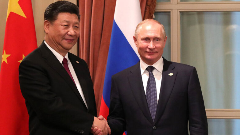 Ушаков назвал успешными переговоры Путина и Си Цзиньпина
