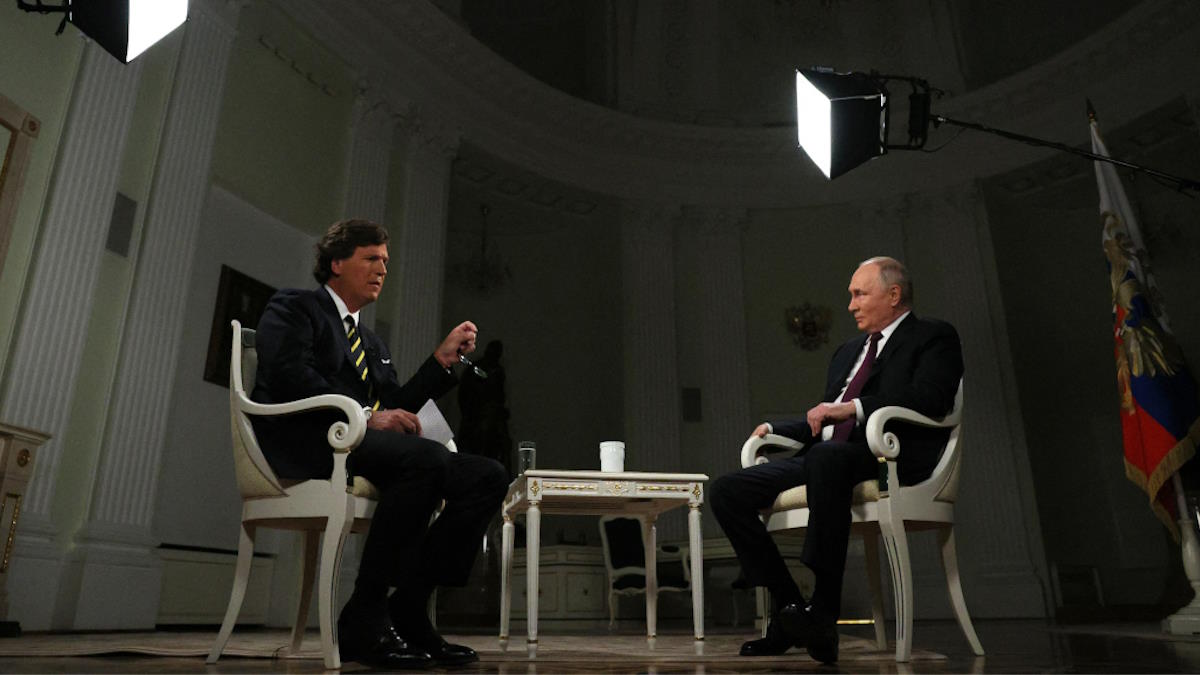 Журналист Такер Карлсон и президент России Владимир Путин